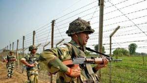 Indian Border Security Force (BSF) soldiers take up positions at an outpost along a fence at the India-Pakistan border. A Pakistani was among two Jaish-e-Mohammed (JeM) terrorists killed in a firefight with security forces in south Kashmir’s Shopian on Wednesday, a police statement said.(AFP) Indian Border Security Force (BSF) soldiers take up positions at an outpost along a fence at the India-Pakistan border. A Pakistani was among two Jaish-e-Mohammed (JeM) terrorists killed in a firefight with security forces in south Kashmir’s Shopian on Wednesday, a police statement said.(AFP)