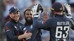 England's spin bowler Adil Rashid celebrates with captain Eoin Morgan and wicket keeper Jos Buttler after dismissing West Indies' Oshane Thomas to win by 30 runs.(AP) England's spin bowler Adil Rashid celebrates with captain Eoin Morgan and wicket keeper Jos Buttler after dismissing West Indies' Oshane Thomas to win by 30 runs.(AP)