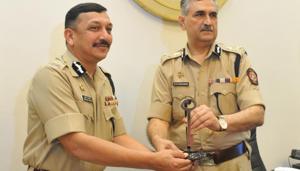 Outgoing Maharashtra DGP Datta Padsalgikar (Right) hands over charge to his successor Subodh Kumar Jaiswal at DGP office, in Mumbai, on Thursday, 28 Feb, 2019.(Bhushan Koynade / HT Photo) Outgoing Maharashtra DGP Datta Padsalgikar (Right) hands over charge to his successor Subodh Kumar Jaiswal at DGP office, in Mumbai, on Thursday, 28 Feb, 2019.(Bhushan Koynade / HT Photo)