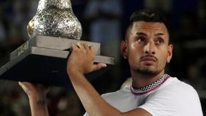 Australia’s Nick Kyrgios celebrates winning the Acapulco Open with the trophy.(REUTERS) Australia’s Nick Kyrgios celebrates winning the Acapulco Open with the trophy.(REUTERS)