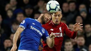 Everton's Cenk Tosun in action with Liverpool's Virgil van Dijk.(REUTERS) Everton's Cenk Tosun in action with Liverpool's Virgil van Dijk.(REUTERS)