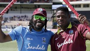 West Indies' Chris Gayle, left, and teammate Oshane Thomas show the stumps after beating England by seven wickets on the fifth One Day International cricket match.(AP) West Indies' Chris Gayle, left, and teammate Oshane Thomas show the stumps after beating England by seven wickets on the fifth One Day International cricket match.(AP)
