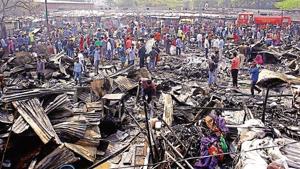 The slum where the fire broke out is inhabited by migrant workers from West Bengal, who mostly work as domestic helps in the city(Yogendra Kumar/HT PHOTO) The slum where the fire broke out is inhabited by migrant workers from West Bengal, who mostly work as domestic helps in the city(Yogendra Kumar/HT PHOTO)