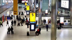 Passengers collect their luggage from the baggage reclaim area of Terminal 5 at London Heathrow Airport in west London on December 19, 2018.(AFP file photo/Image for representation.) Passengers collect their luggage from the baggage reclaim area of Terminal 5 at London Heathrow Airport in west London on December 19, 2018.(AFP file photo/Image for representation.)