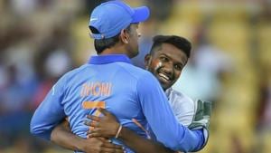 MS Dhoni accepts greetings from a pitch-invader during the 2nd ODI match against Australia.(AP) MS Dhoni accepts greetings from a pitch-invader during the 2nd ODI match against Australia.(AP)