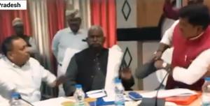 Screengrab of the video showing BJP MP Sharad Tripathi and party MLA Rakesh Singh Baghel exchanging blows at a meeting in Uttar Pradesh’s Sant Kabir Nagar. Screengrab of the video showing BJP MP Sharad Tripathi and party MLA Rakesh Singh Baghel exchanging blows at a meeting in Uttar Pradesh’s Sant Kabir Nagar.
