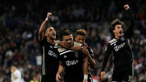 Ajax's Dusan Tadic celebrates scoring their third goal against Real Madrid with David Neres, Hakim Ziyech and Nicolas Tagliafico .(REUTERS)