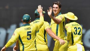 Australian cricketer Pat Cummins (2nd R) celebrates with teammates after taking the wicket of Indian batsman Rohit Sharma during the second one-day international (ODI)(AFP) Australian cricketer Pat Cummins (2nd R) celebrates with teammates after taking the wicket of Indian batsman Rohit Sharma during the second one-day international (ODI)(AFP)