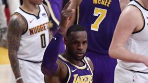 Los Angeles Lakers forward LeBron James gestures after scoring against the Denver Nuggets during the first half of an NBA basketball game.(AP) Los Angeles Lakers forward LeBron James gestures after scoring against the Denver Nuggets during the first half of an NBA basketball game.(AP)