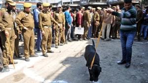 A sniffer dog and police personnel at Thursday’s grenade blast site in Jammu.(Nitin Kanotra / Hindustan Times) A sniffer dog and police personnel at Thursday’s grenade blast site in Jammu.(Nitin Kanotra / Hindustan Times)