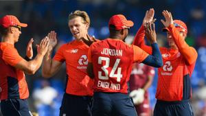 David Willey (2L), Chris Jordan (2R) and Eoin Morgan (R) of England celebrate the dismissal of Shimron Hetmyer of West Indies during the 3rd and final T20I between West Indies and England(AFP) David Willey (2L), Chris Jordan (2R) and Eoin Morgan (R) of England celebrate the dismissal of Shimron Hetmyer of West Indies during the 3rd and final T20I between West Indies and England(AFP)