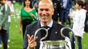 Zinedine Zidane poses with the trophy after winning the UEFA Champions League final .(AFP)