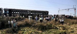 People gather near the bogies of Samjhuata Express after an explosion.(PTI file photo) People gather near the bogies of Samjhuata Express after an explosion.(PTI file photo)