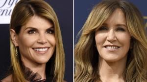 This combination photo shows actress Lori Loughlin at the Women's Cancer Research Fund's An Unforgettable Evening event in Beverly Hills, Calif., on Feb. 27, 2018, left, and actress Felicity Huffman at the 70th Primetime Emmy Awards in Los Angeles on Sept. 17, 2018. Loughlin and Huffman are among at least 40 people indicted in a sweeping college admissions bribery scandal. Both were charged with conspiracy to commit mail fraud and wire fraud in indictments unsealed Tuesday in federal court in Boston. (AP Photo)(AP)
