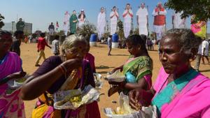 Supporters have their meals in the backdrop of huge cut-outs of political leaders at a rally of the BJP-AIADMK-PMK alliance, in Chennai on March 6.(PTI) Supporters have their meals in the backdrop of huge cut-outs of political leaders at a rally of the BJP-AIADMK-PMK alliance, in Chennai on March 6.(PTI)