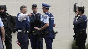 Christchurch: Police stand outside a mosque in central Christchurch, New Zealand on Friday. At least 49 people were killed in mass shootings at two mosques full of people attending Friday prayers.(AP) Christchurch: Police stand outside a mosque in central Christchurch, New Zealand on Friday. At least 49 people were killed in mass shootings at two mosques full of people attending Friday prayers.(AP)