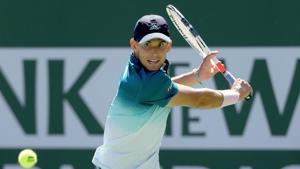 Dominic Thiem of Austria returns a shot to Milos Roanic at the Indian Wells Masters.(AFP) Dominic Thiem of Austria returns a shot to Milos Roanic at the Indian Wells Masters.(AFP)