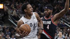San Antonio Spurs guard DeMar DeRozan (10) drives around Portland Trail Blazers forward Maurice Harkless (4) during a NBA match.(AP) San Antonio Spurs guard DeMar DeRozan (10) drives around Portland Trail Blazers forward Maurice Harkless (4) during a NBA match.(AP)