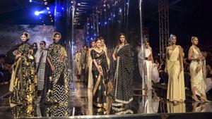 Bollywood actors Aditi Rao Hydari, Diana Penty and other models walk the ramp at the grand finale of India Fashion Week, in New Delhi, Sunday.(PTI)