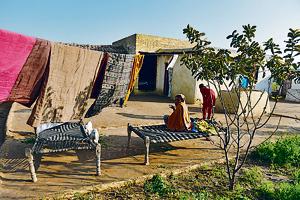 In the courtyard: A home near the India-Pakistan border.(AFP) In the courtyard: A home near the India-Pakistan border.(AFP)