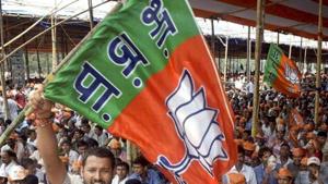 A BJP supporter waves a party flag.(PTI File Photo/Representative image) A BJP supporter waves a party flag.(PTI File Photo/Representative image)