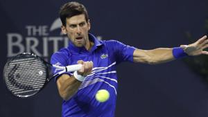 Novak Djokovic of Serbia hits a forehand against Bernard Tomic of Australia.(USA TODAY Sports) Novak Djokovic of Serbia hits a forehand against Bernard Tomic of Australia.(USA TODAY Sports)