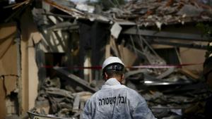 An Israeli police officer inspects the damage to a house hit by a rocket in Mishmeret, central Israel on March 25.(AP Photo) An Israeli police officer inspects the damage to a house hit by a rocket in Mishmeret, central Israel on March 25.(AP Photo)
