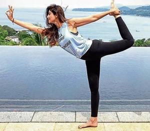 The natrajasana (Natraj pose) sculpts arms and calves, enhances mental focus and back flexibility.(Instagram/TheShilpaShetty)