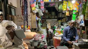 Babu Ram is spotted in this posture just about every evening poring over a newspaper while his son bustles about serving customers in the Central Delhi market. Babu Ram is spotted in this posture just about every evening poring over a newspaper while his son bustles about serving customers in the Central Delhi market.