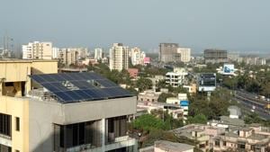 The 7.15 kilowatt-power (kWp) solar power plant installed at the society’s rooftop.(HT Photo) The 7.15 kilowatt-power (kWp) solar power plant installed at the society’s rooftop.(HT Photo)