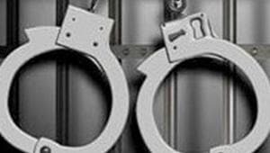 Small-time criminal, aide shoot video brandishing firearm, held Small-time criminal, aide shoot video brandishing firearm, held