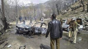 Security personnel inspect the mangled remains of a car which exploded near a CRPF convoy on the Jammu-Srinagar highway at Banihal in Ramban district of Jammu and Kashmir on March 30.(PTI) Security personnel inspect the mangled remains of a car which exploded near a CRPF convoy on the Jammu-Srinagar highway at Banihal in Ramban district of Jammu and Kashmir on March 30.(PTI)
