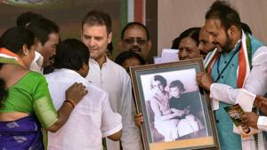 Congress party workers present a framed portrait of Indira Gandhi to Congress President Rahul Gandhi during a public rally at Zaheerabad,Telangana, on Monday.(PTI) Congress party workers present a framed portrait of Indira Gandhi to Congress President Rahul Gandhi during a public rally at Zaheerabad,Telangana, on Monday.(PTI)