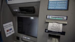A group of unidentified thieves allegedly cut open an ATM belonging to a private bank, stole <span class='webrupee'>₹</span>16.77 lakh, and then set fire to it in Sector 38’s Jharsa village on Thursday morning.(Bloomberg File Photo) A group of unidentified thieves allegedly cut open an ATM belonging to a private bank, stole <span class='webrupee'>₹</span>16.77 lakh, and then set fire to it in Sector 38’s Jharsa village on Thursday morning.(Bloomberg File Photo)