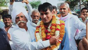 Passers-by would scarcely notice a man quietly watering plants at the BJP headquarters in Jaipur. But of late Murlidhar Meena has been garnering attention and congratulations after his younger son cleared the UPSC exam. His son, Brijmohan Meena, got 713 rank in the UPSC exam in his second attempt.(HT photo) Passers-by would scarcely notice a man quietly watering plants at the BJP headquarters in Jaipur. But of late Murlidhar Meena has been garnering attention and congratulations after his younger son cleared the UPSC exam. His son, Brijmohan Meena, got 713 rank in the UPSC exam in his second attempt.(HT photo)