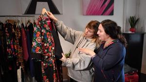 Hungarian Roma fashion designer and founder of “Romani Design” Erika Varga (R) talks with a model before a video and photo shooting for a campaign to promote acceptance of the otherness, dignity, freedom of belief and respect of differences on March 3, 2019 at Romani Design’s studio in Budapest. - Founded in 2010 by Varga to promote Roma fashion and identity, her Romani Design studio brought out its first collection the same year.(ATTILA KISBENEDEK / AFP) Hungarian Roma fashion designer and founder of “Romani Design” Erika Varga (R) talks with a model before a video and photo shooting for a campaign to promote acceptance of the otherness, dignity, freedom of belief and respect of differences on March 3, 2019 at Romani Design’s studio in Budapest. - Founded in 2010 by Varga to promote Roma fashion and identity, her Romani Design studio brought out its first collection the same year.(ATTILA KISBENEDEK / AFP)