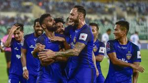 File image of Chennaiyin FC player C. K. Vineeth celebrating with teammates after scoring a goal.(PTI)