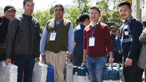 Polling officials head for polling stations with carrying the Electronic Voting Machines (EVM) from the distribution centre in Gangtok on Wednesday.(ANI) Polling officials head for polling stations with carrying the Electronic Voting Machines (EVM) from the distribution centre in Gangtok on Wednesday.(ANI)