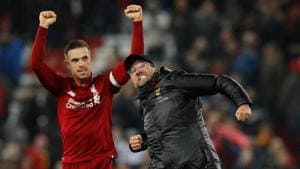 Liverpool manager Juergen Klopp and Jordan Henderson celebrate at the end of the match.(REUTERS)