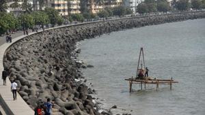 Workers conducted soil testing for the coastal road project at Marine Drive in Mumbai on April 5.(Satyabrata Tripathy/HT Photo) Workers conducted soil testing for the coastal road project at Marine Drive in Mumbai on April 5.(Satyabrata Tripathy/HT Photo)