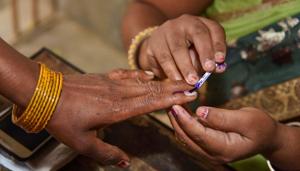 An election officer puts an indelible ink mark on the finger of a voter on Thursday, April 11.(PTI) An election officer puts an indelible ink mark on the finger of a voter on Thursday, April 11.(PTI)