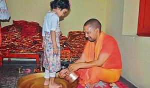Chief Minister Yogi Adityanath performing Kanya Pujan.(HT) Chief Minister Yogi Adityanath performing Kanya Pujan.(HT)