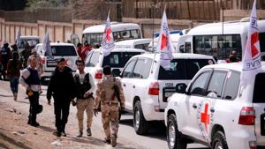 International Committee of the Red Cross (ICRC) convoy seen crossing into eastern Ghouta near Wafideen camp in Damascus, Syria.(REUTERS) International Committee of the Red Cross (ICRC) convoy seen crossing into eastern Ghouta near Wafideen camp in Damascus, Syria.(REUTERS)