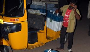 The dummy EVMs were being shifted from the local tehsildar’s office to the strong room at the Indoor Stadium in Jagitial in an auto rickshaw.(HT PHOTO)