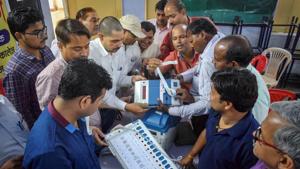 Poll officials demonstrate the functioning of Electronic Voting Machines (EVM) and Voter Verified Paper Audit Trail (VVPAT) during a training programme for the Lok Sabha elections.(PTI)