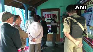 People queue up outside a polling station in Doda under Udhampur parliamentary constituency.(ANI photo)
