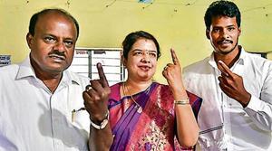 CM HD Kumaraswamy, his wife and son cast their votes.(PTI file photo)