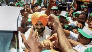 Congress star campaigner Navjot Singh Sidhu meets supporters during a road show at Kozhikode in Kerala on Thursday.(PTI)