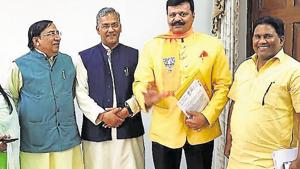 Chief Minister Trivendra Singh Rawat (C) with BJP MLAs Kunwar Pranav Champion (2nd R) and Deshraj Karnwal (R) , after a meeting in Dehradun on Thursday, April 18, 2019.(HT Photo) Chief Minister Trivendra Singh Rawat (C) with BJP MLAs Kunwar Pranav Champion (2nd R) and Deshraj Karnwal (R) , after a meeting in Dehradun on Thursday, April 18, 2019.(HT Photo)