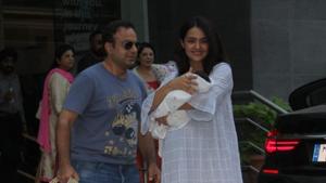 Surveen Chawla poses with husband Akshay Thakker and daughter Eva.